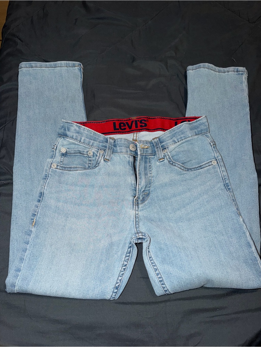 Levi's Women's Light Blue Skinny Jeans with Red Waistband Detail